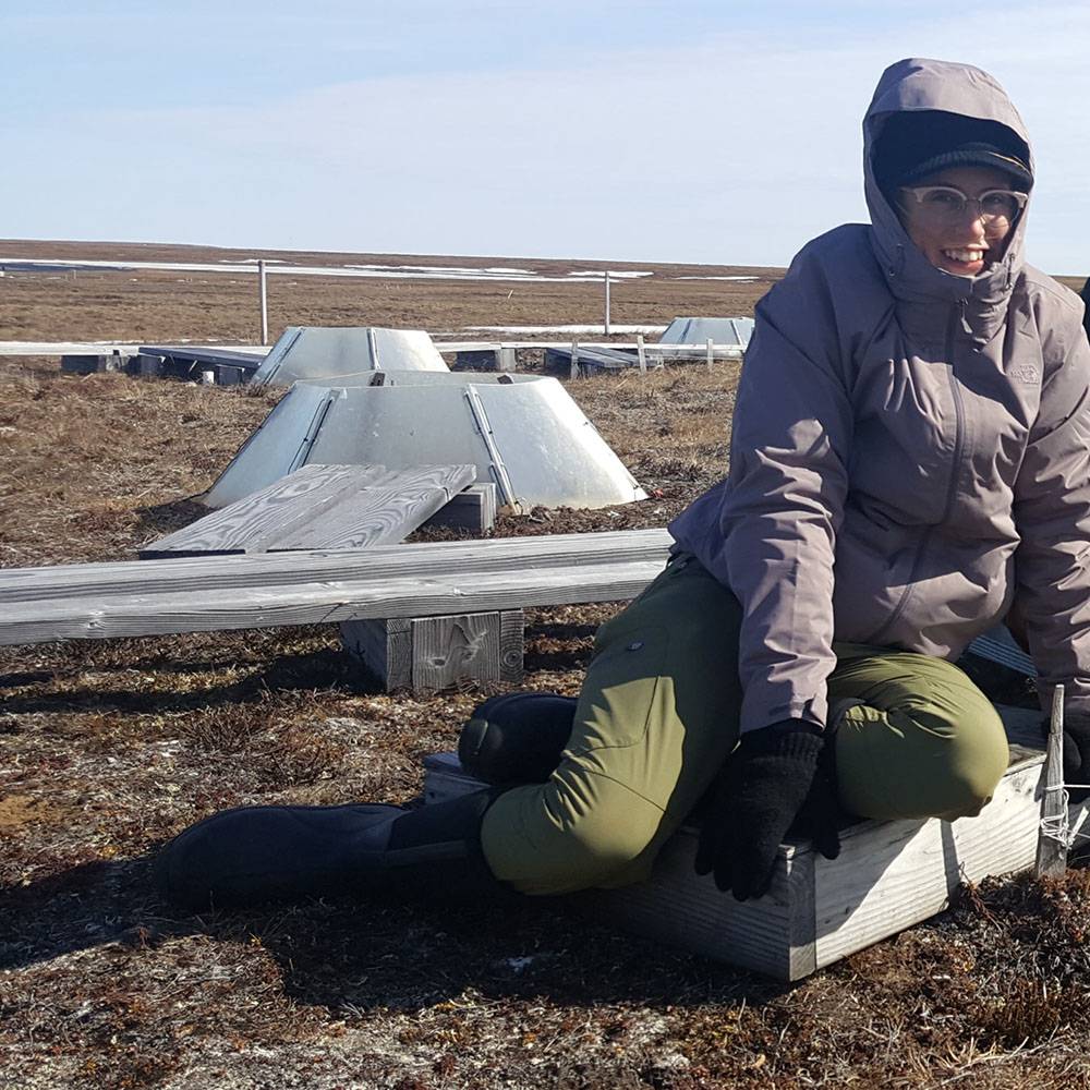 Kailey smiles from her position on the tundra.